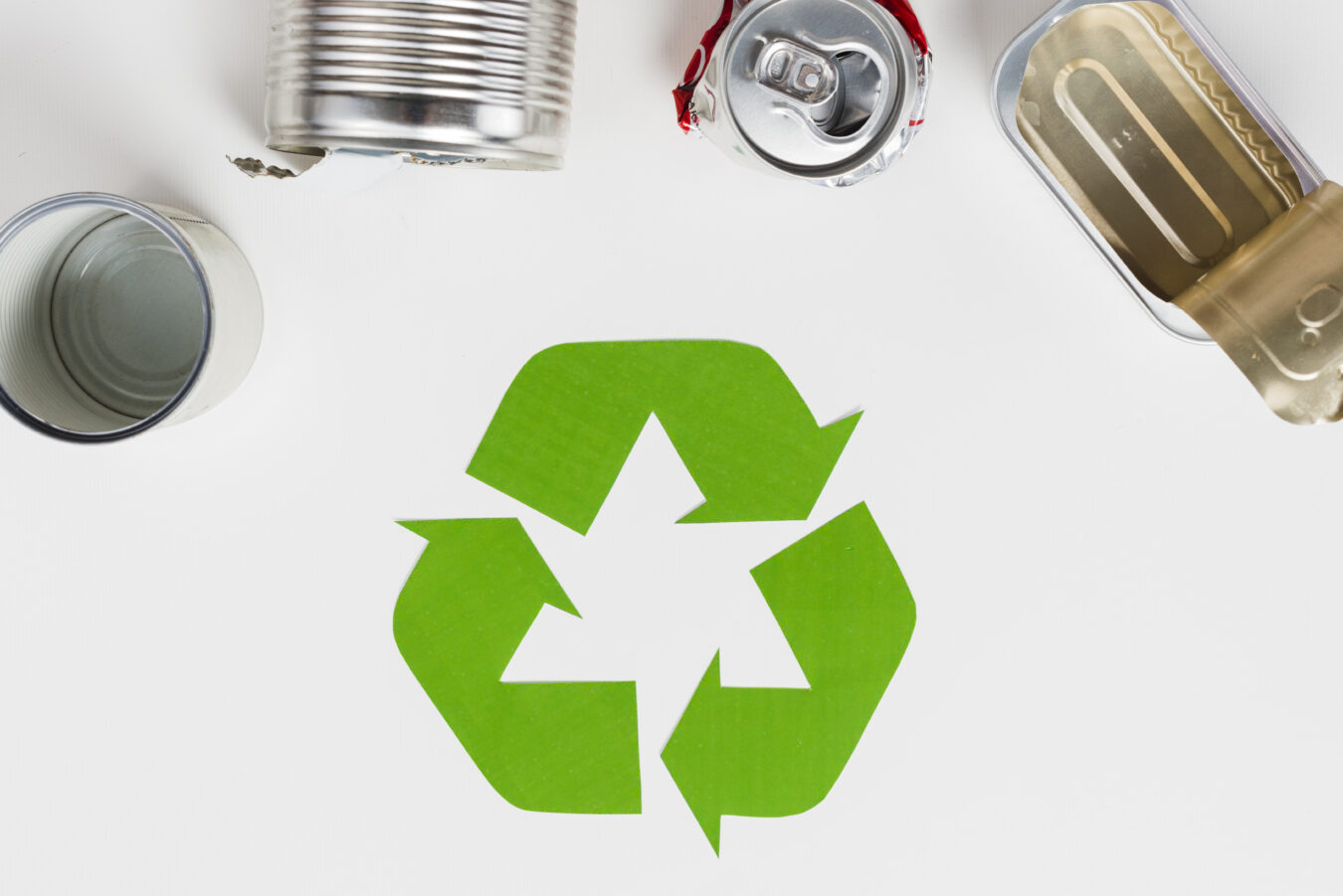 recycling-symbol-beside-used-metallic-packaging